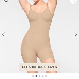 Skims seamless solution wear mid thigh bodysuit, color Clay